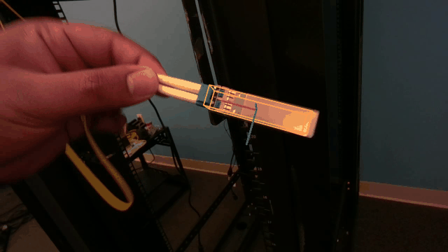 Markerless RGB-D tracking overlay showing the estimated 6-DoF pose of a handheld plug